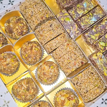 Balanced B Bites laddoos and dry fruit sweets in gift trays
